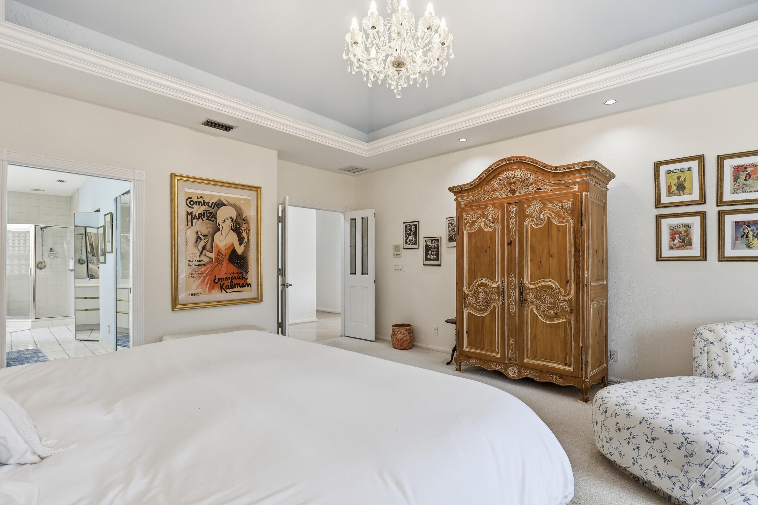 2248 Northwest 60th Street Boca Raton, FL 33496 - Photo 34 of 70 a bedroom with a large bed and a chandelier