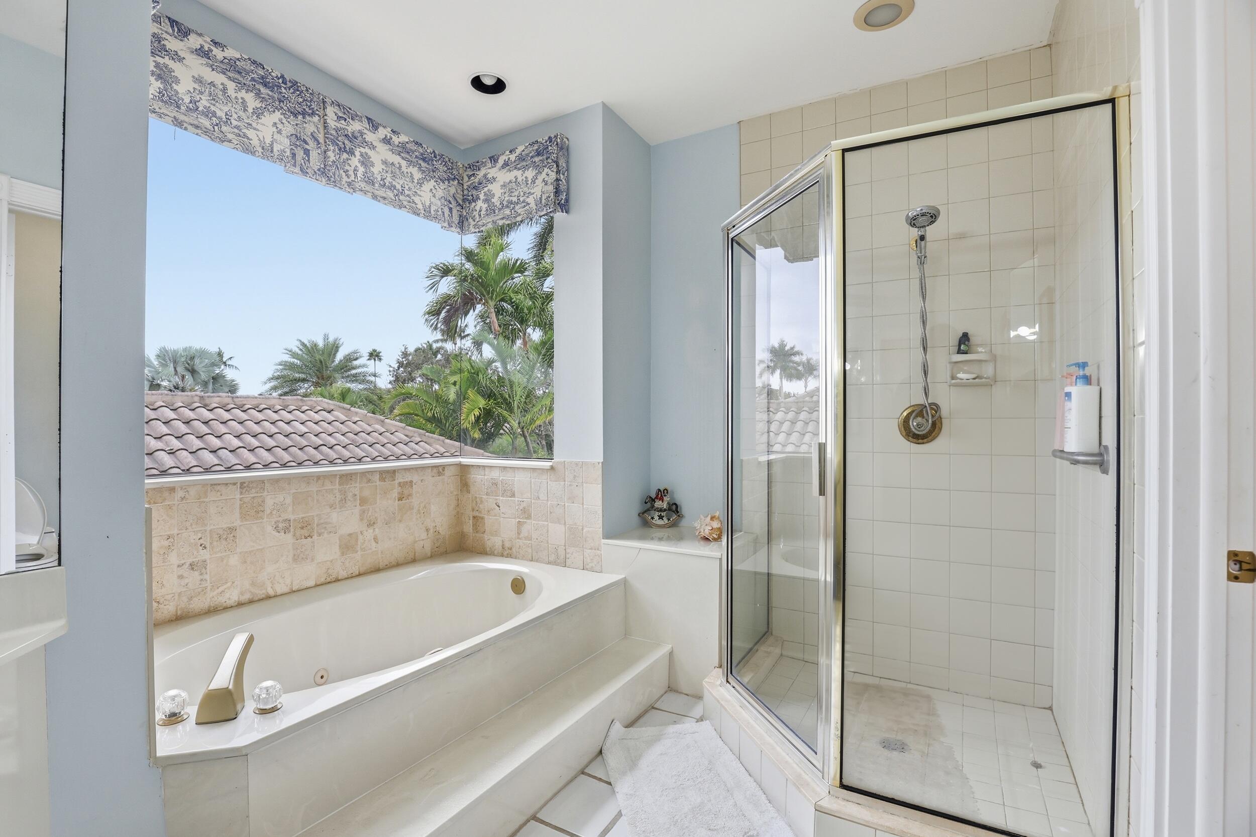 2248 Northwest 60th Street Boca Raton, FL 33496 - Photo 37 of 70 a bathroom with a bathtub and a shower