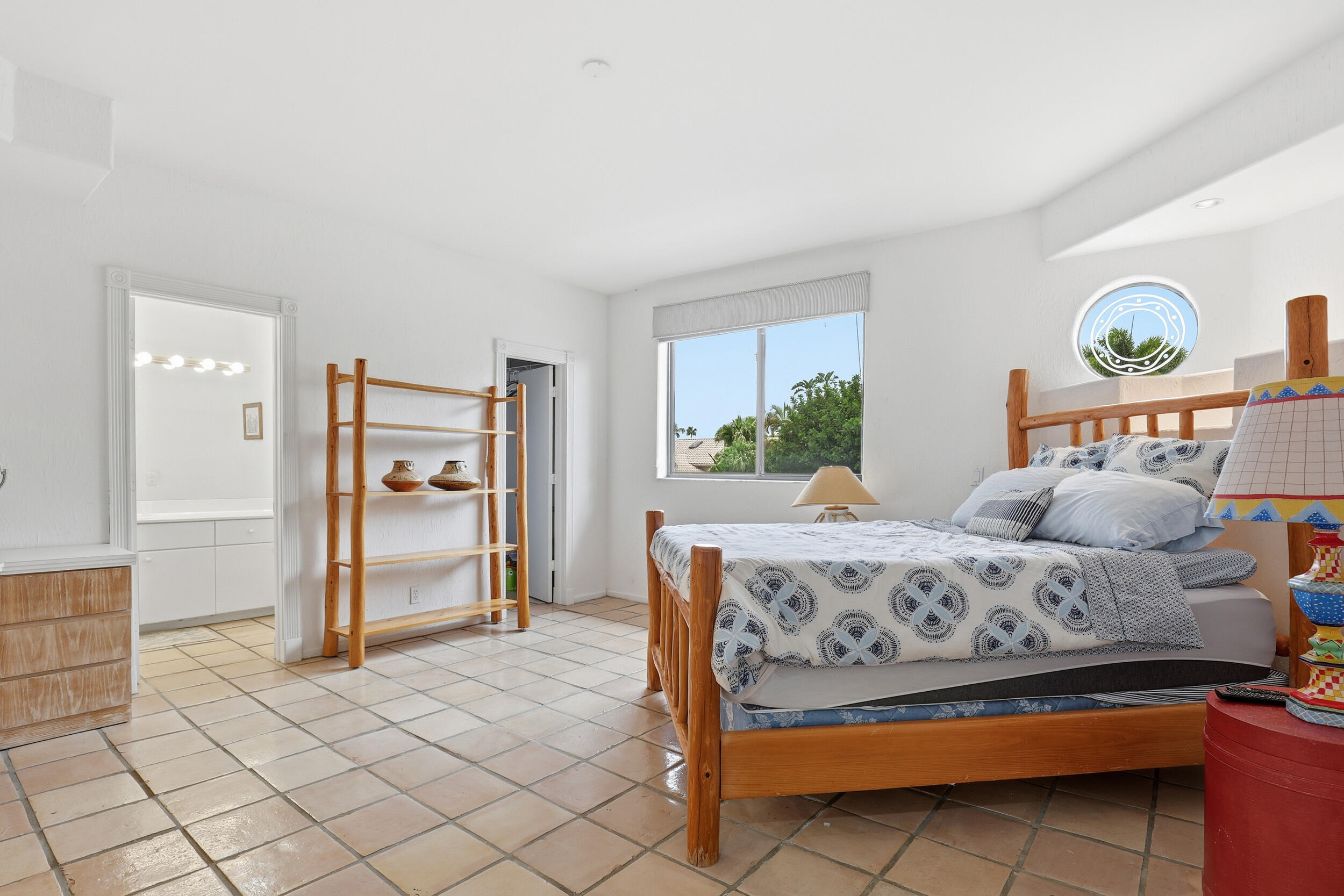 2248 Northwest 60th Street Boca Raton, FL 33496 - Photo 41 of 70 a bedroom with a bed and a table in it