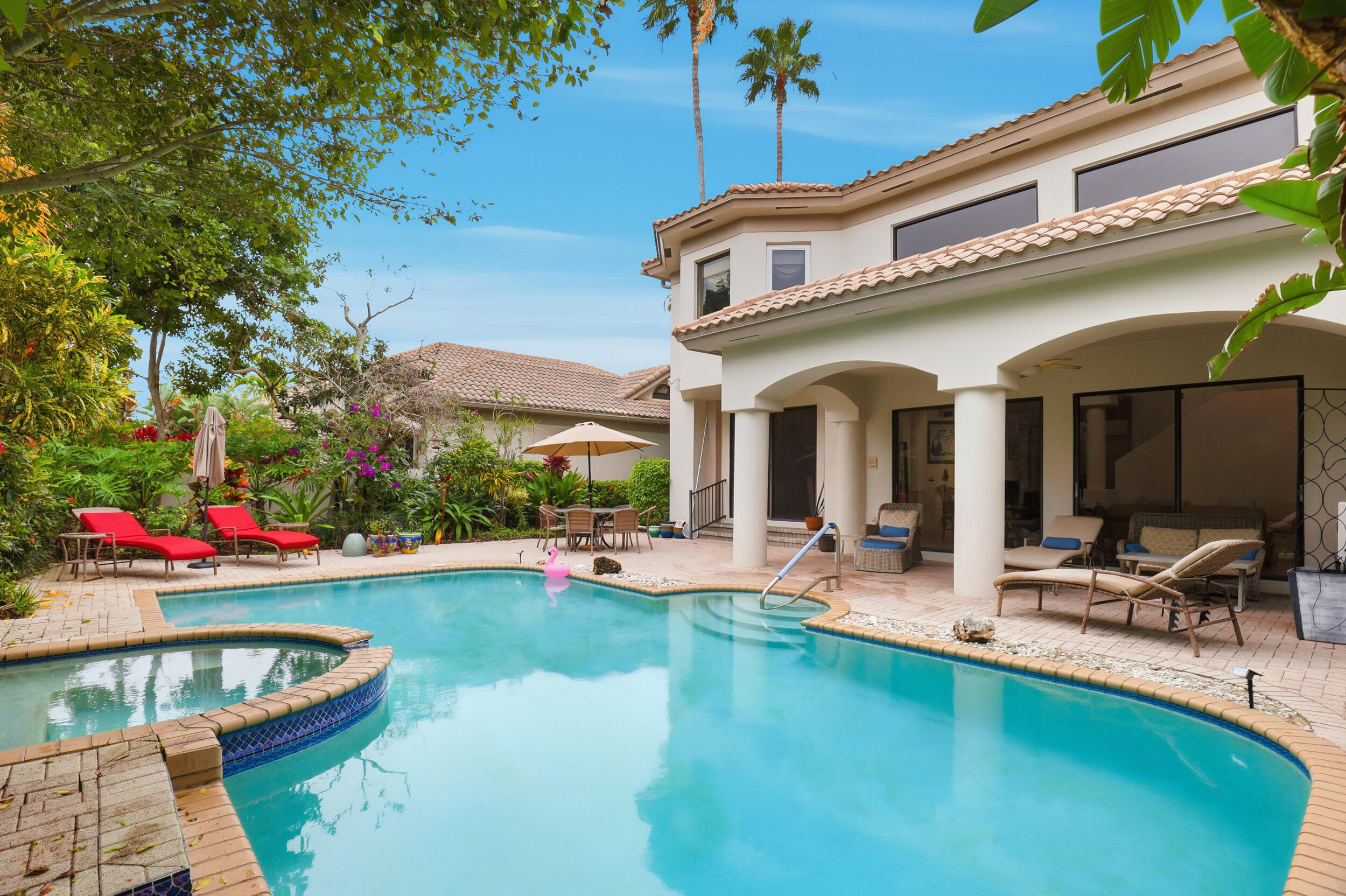 2248 Northwest 60th Street Boca Raton, FL 33496 - Photo 54 of 70 a view of a house with swimming pool and sitting area