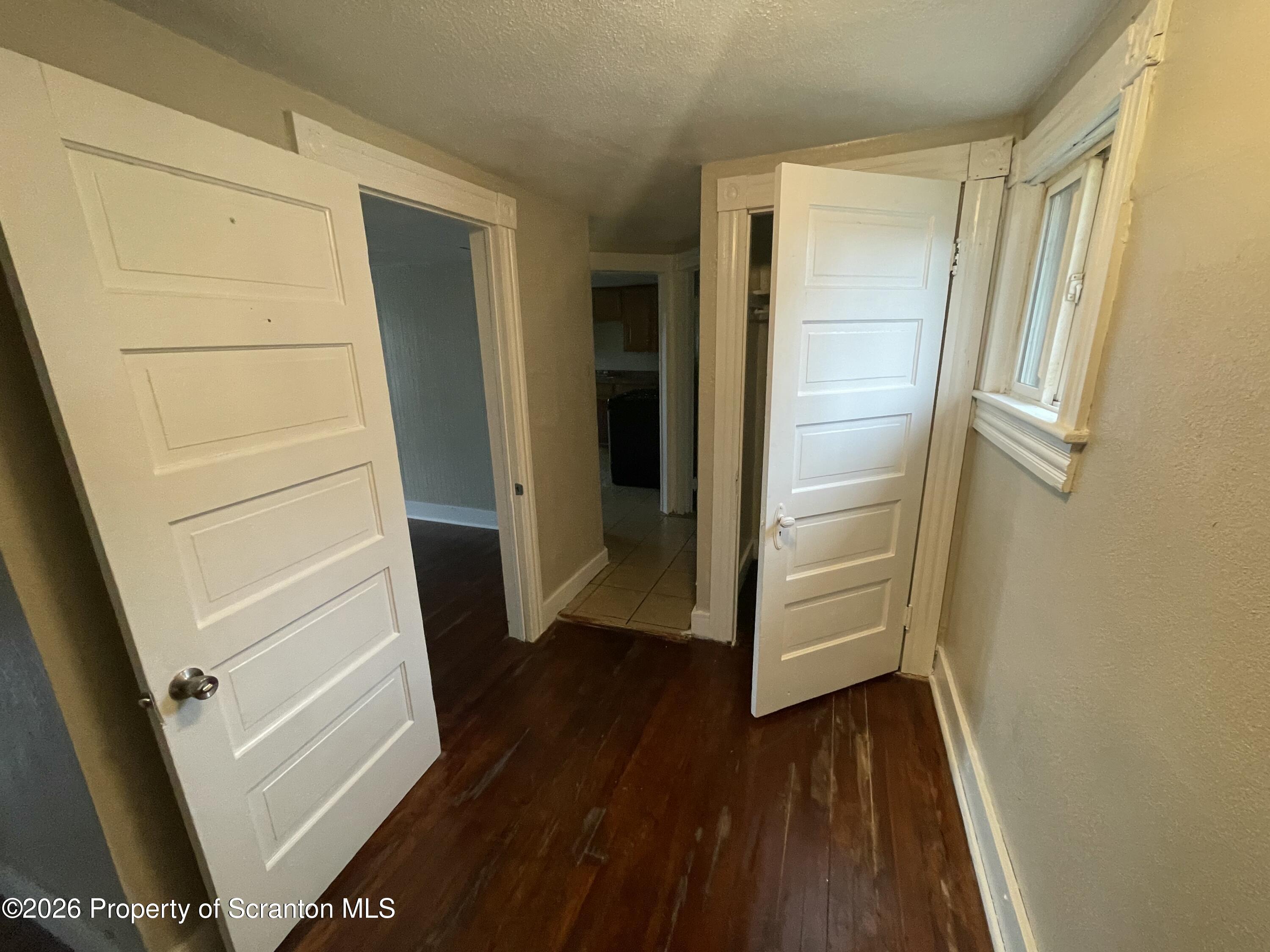 401 Putnam Street Scranton, PA 18508 - Photo 17 of 29 a view of walk in closet with wooden floor