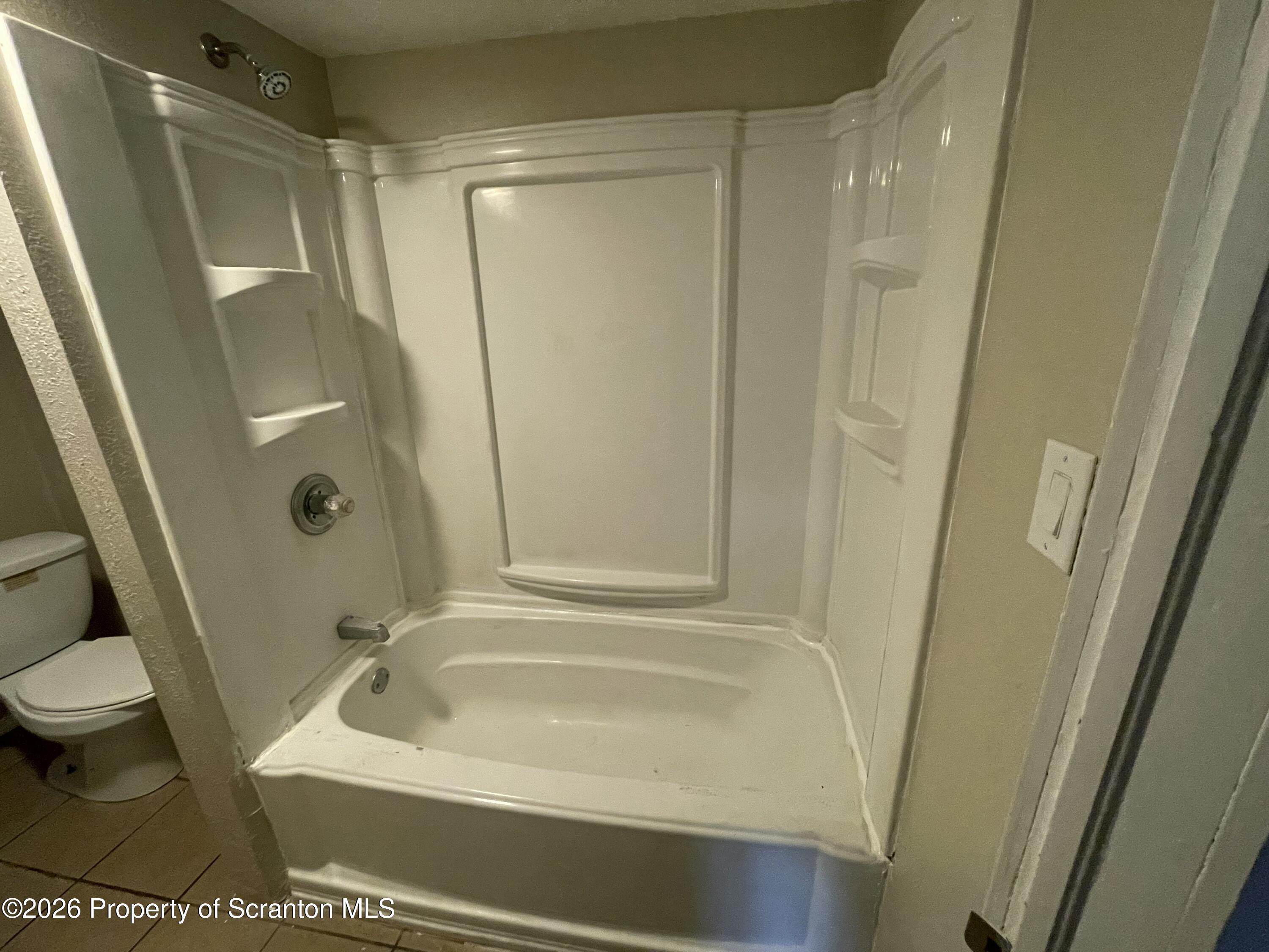 401 Putnam Street Scranton, PA 18508 - Photo 20 of 29 a bathroom with a tub and a shower