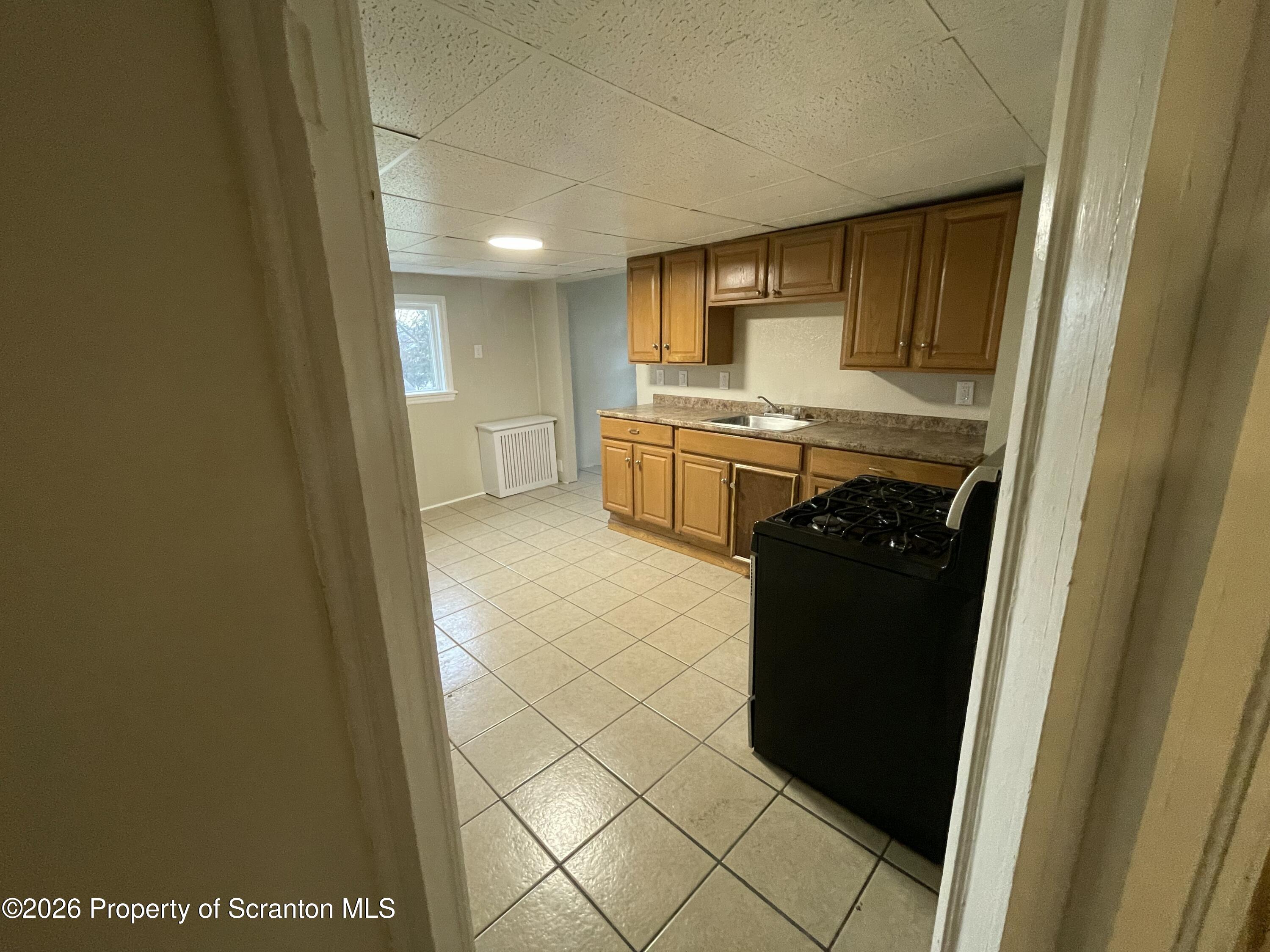401 Putnam Street Scranton, PA 18508 - Photo 21 of 29 a bathroom with a sink and a mirror