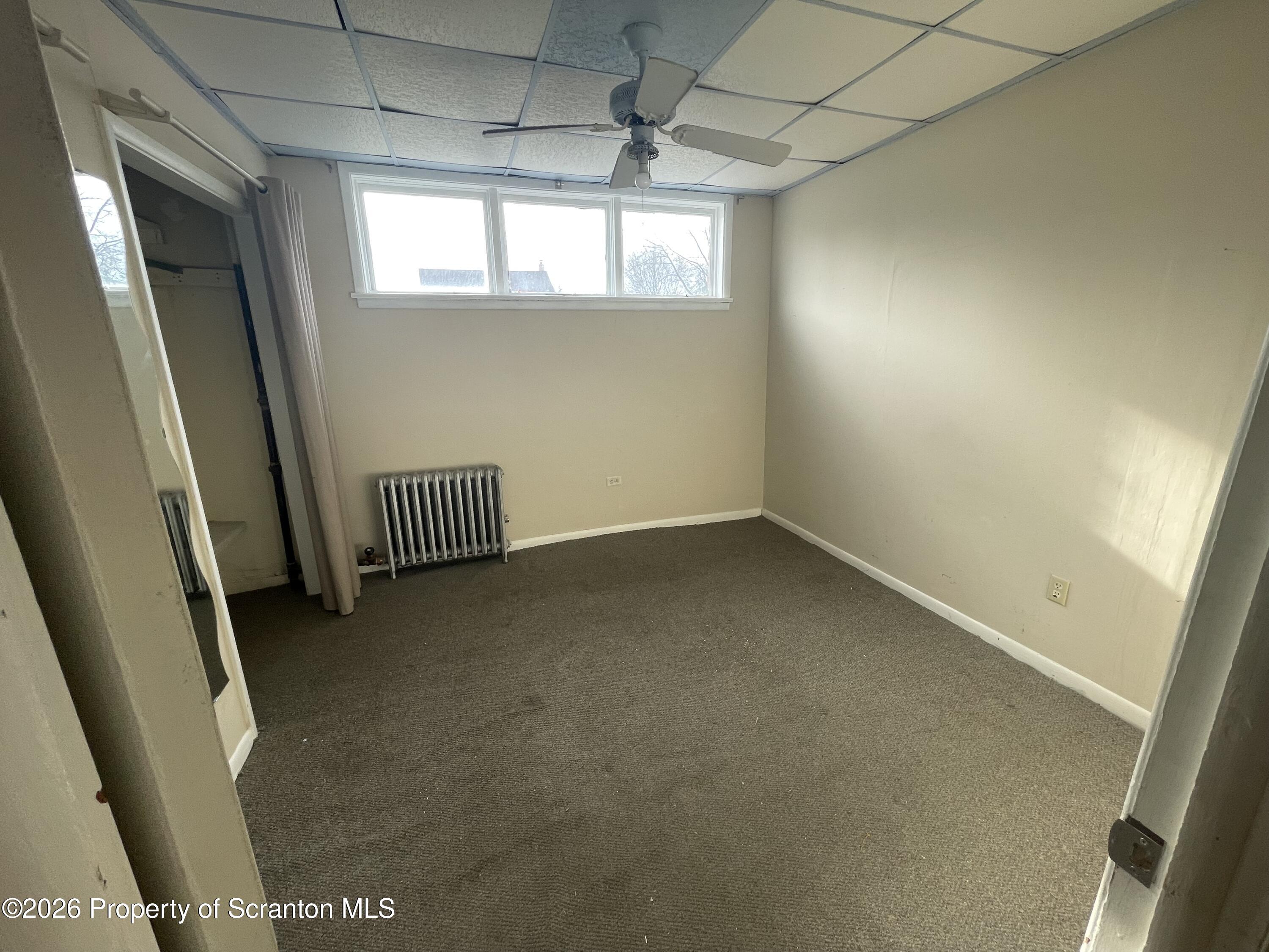 401 Putnam Street Scranton, PA 18508 - Photo 5 of 29 a view of room with window and stairs