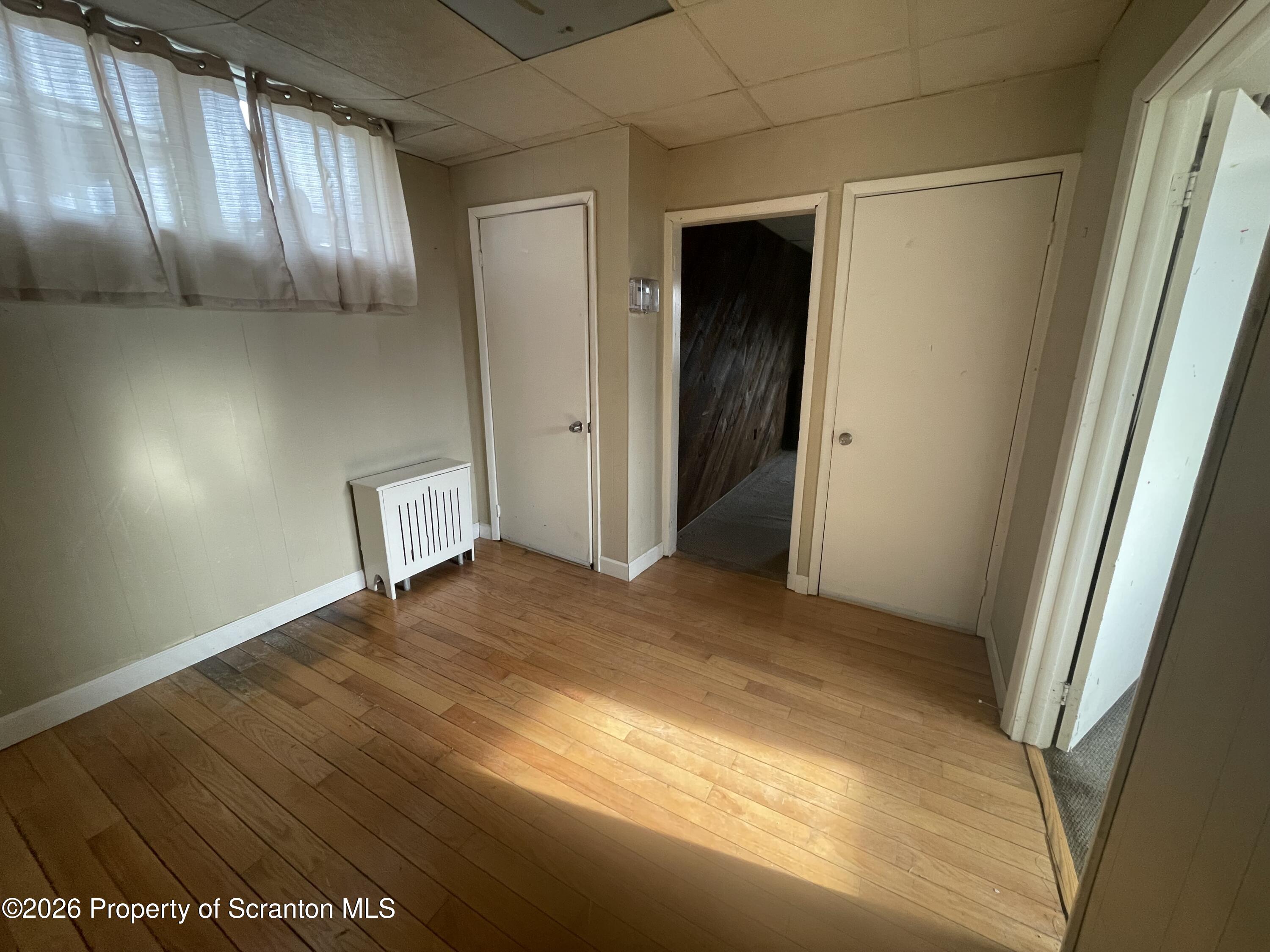 401 Putnam Street Scranton, PA 18508 - Photo 6 of 29 a view of empty room with wooden floor