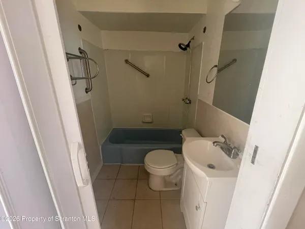 a bathroom with a sink and toilet