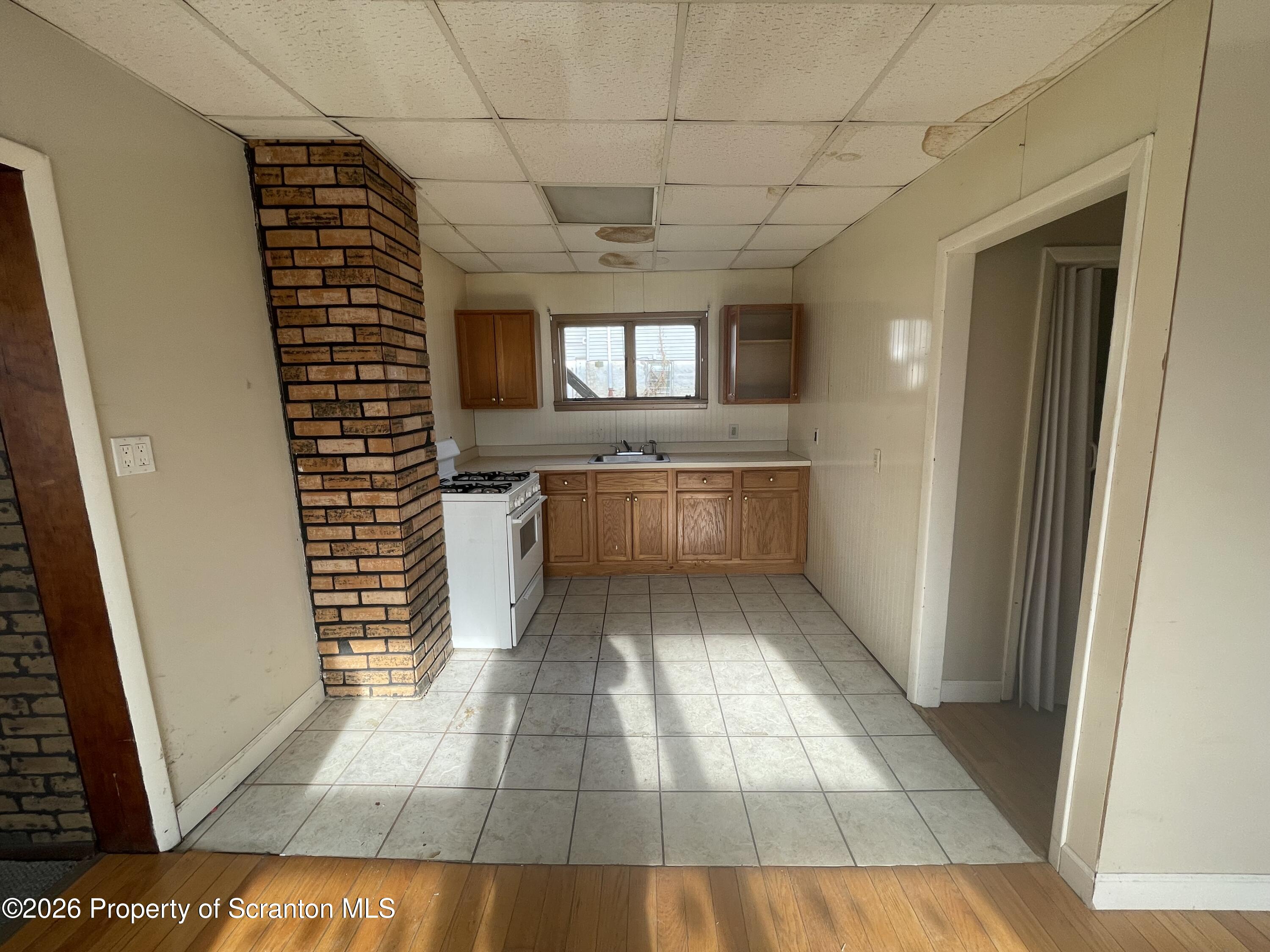 401 Putnam Street Scranton, PA 18508 - Photo 10 of 29 a view of a kitchen with a sink and dishwasher