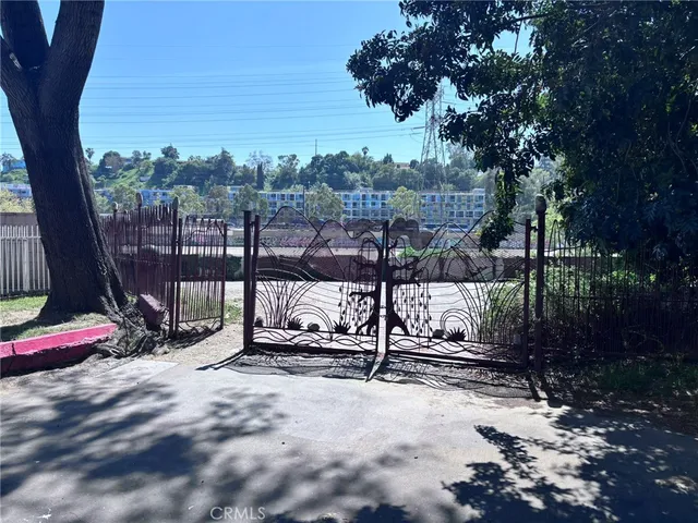 a view of a city with tall trees