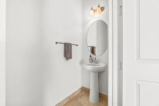 a bathroom with a sink and mirror