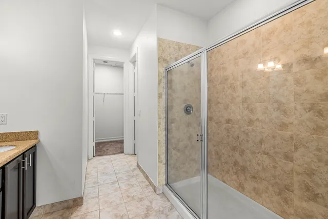 a bathroom with a shower and a sink