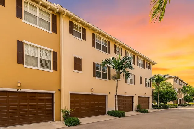 a front view of a house with garage