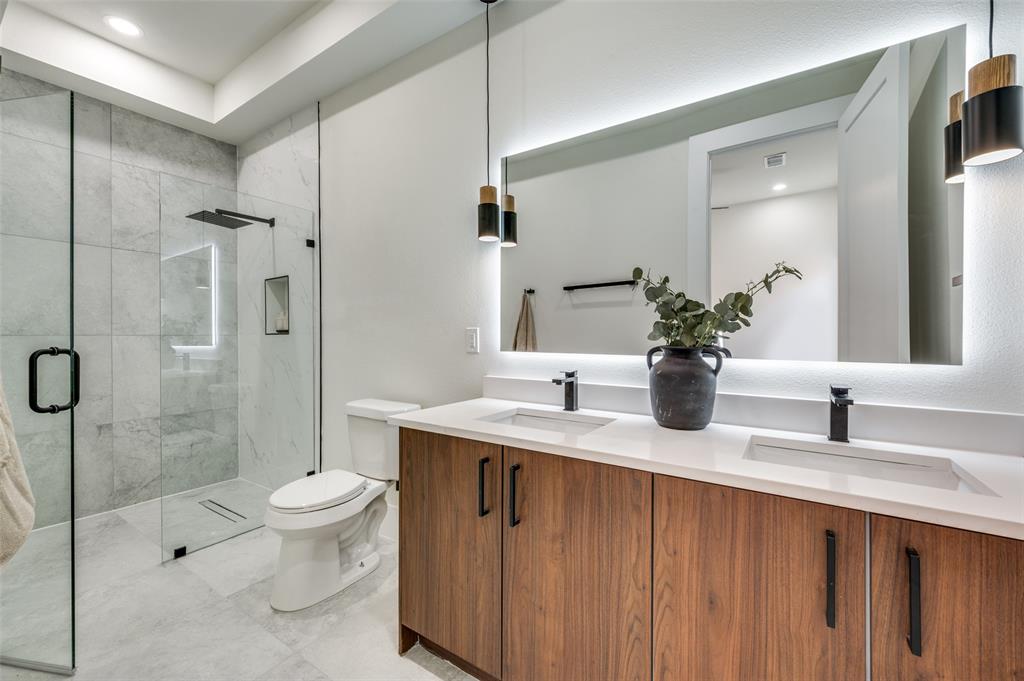 3314 Navaro Street Dallas, TX 75212 - Photo 12 of 24 a bathroom with a granite countertop sink toilet and shower