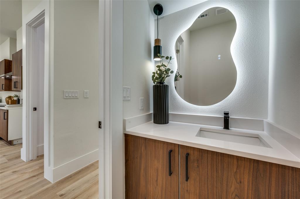 3314 Navaro Street Dallas, TX 75212 - Photo 13 of 24 a bathroom with a sink and a mirror