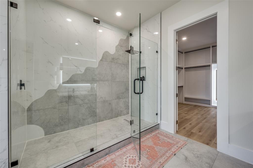3314 Navaro Street Dallas, TX 75212 - Photo 18 of 24 a bathroom with a glass shower door and a sink