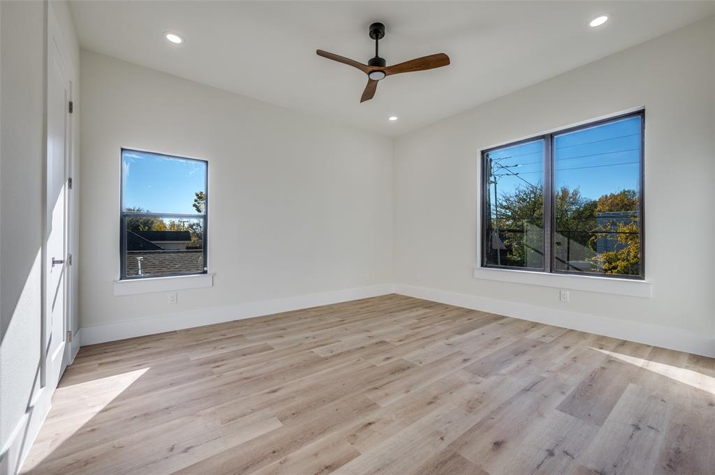3314 Navaro Street Dallas, TX 75212 - Photo 20 of 24 a view of a big room with wooden floor and a window