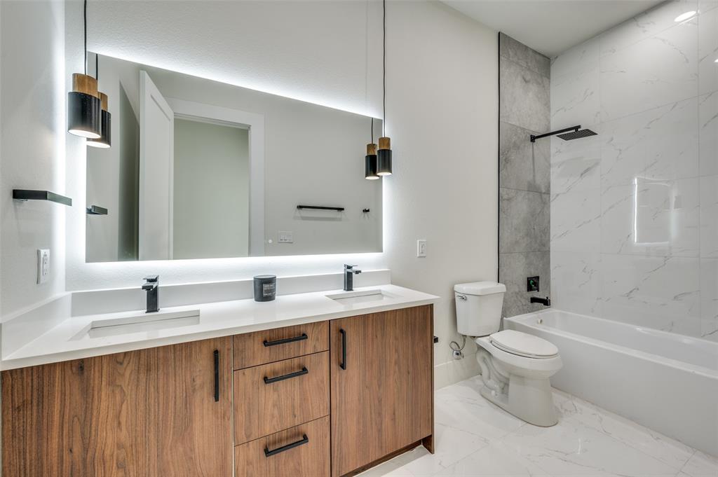 3314 Navaro Street Dallas, TX 75212 - Photo 22 of 24 a bathroom with a double vanity sink toilet and shower