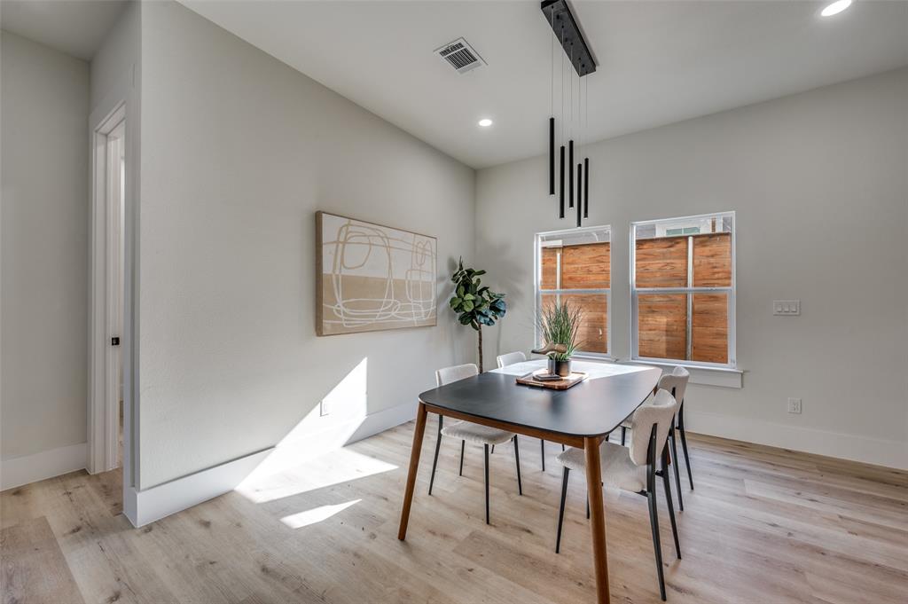 3314 Navaro Street Dallas, TX 75212 - Photo 9 of 24 a workspace with furniture window and wooden floor