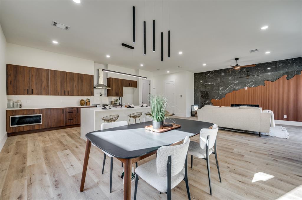 3314 Navaro Street Dallas, TX 75212 - Photo 10 of 24 a kitchen with a table chairs microwave and cabinets
