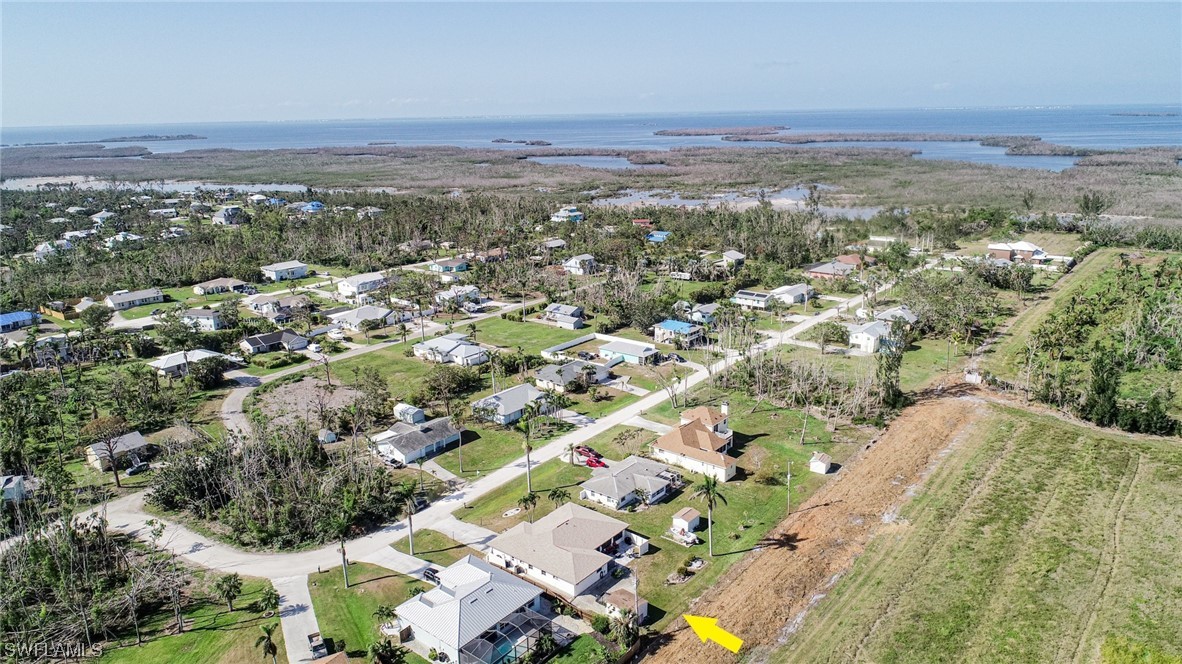 5774 Samoa Drive Bokeelia, FL 33922 - Photo 42 of 43 an aerial view of residential building and green space