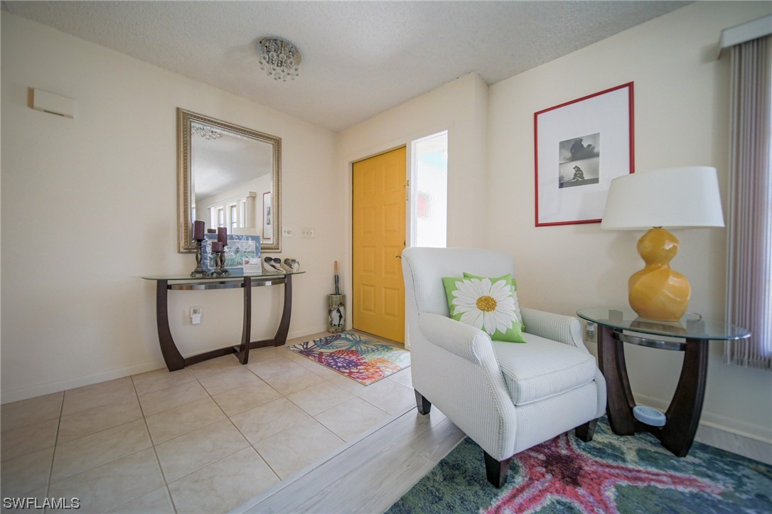 5774 Samoa Drive Bokeelia, FL 33922 - Photo 8 of 43 a living room with furniture and next to a window