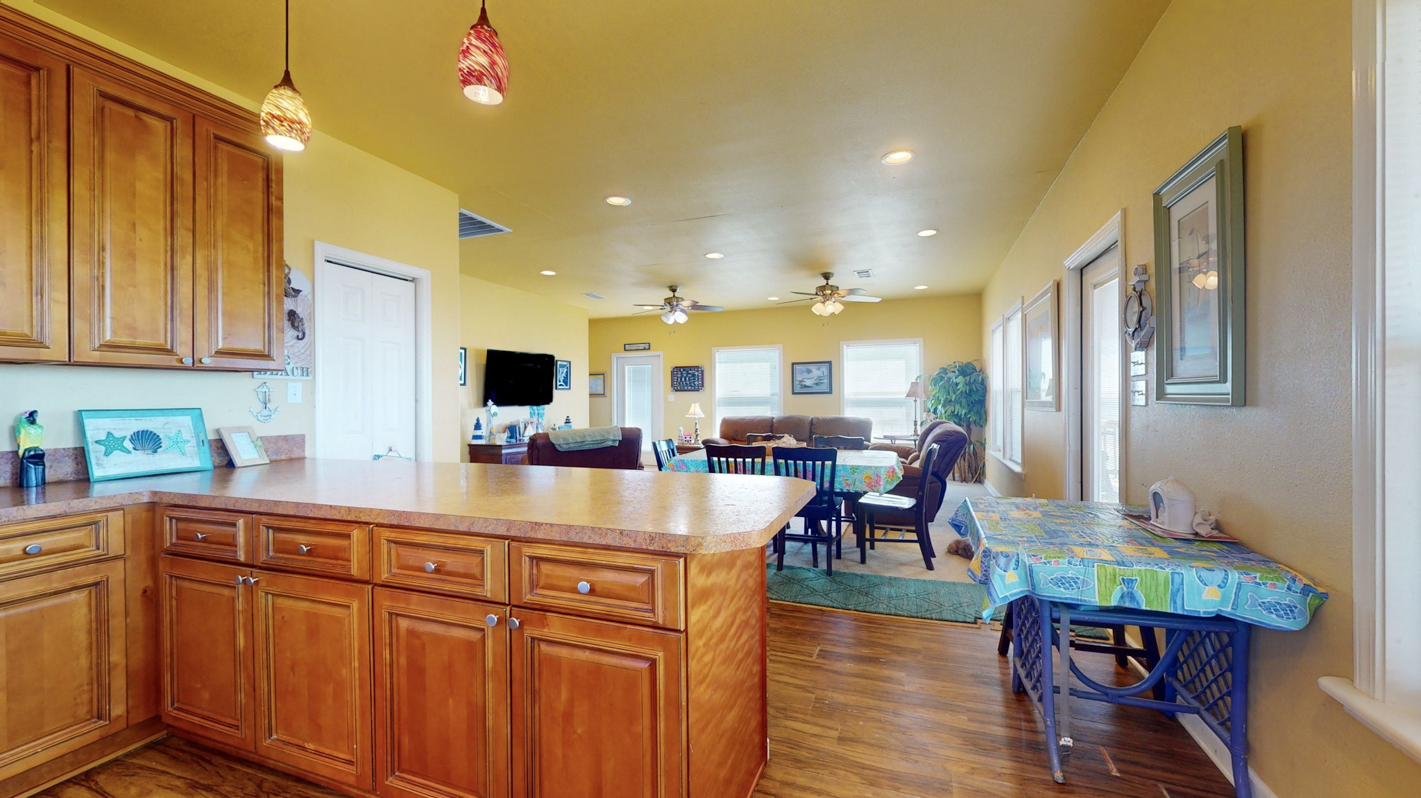 982 Kirks Road Port Bolivar, TX 77650 - Photo 12 of 39 a kitchen with stainless steel appliances granite countertop a table chairs and a refrigerator