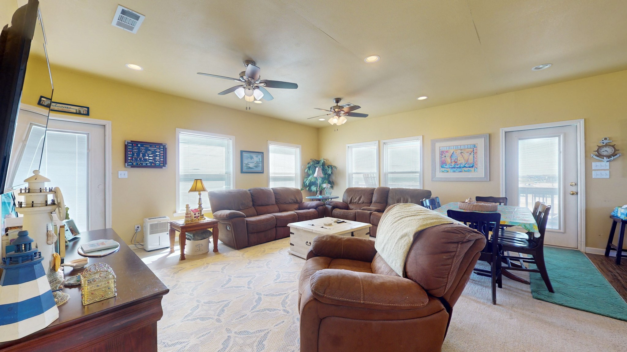 982 Kirks Road Port Bolivar, TX 77650 - Photo 14 of 39 a living room with furniture dining area and a chandelier