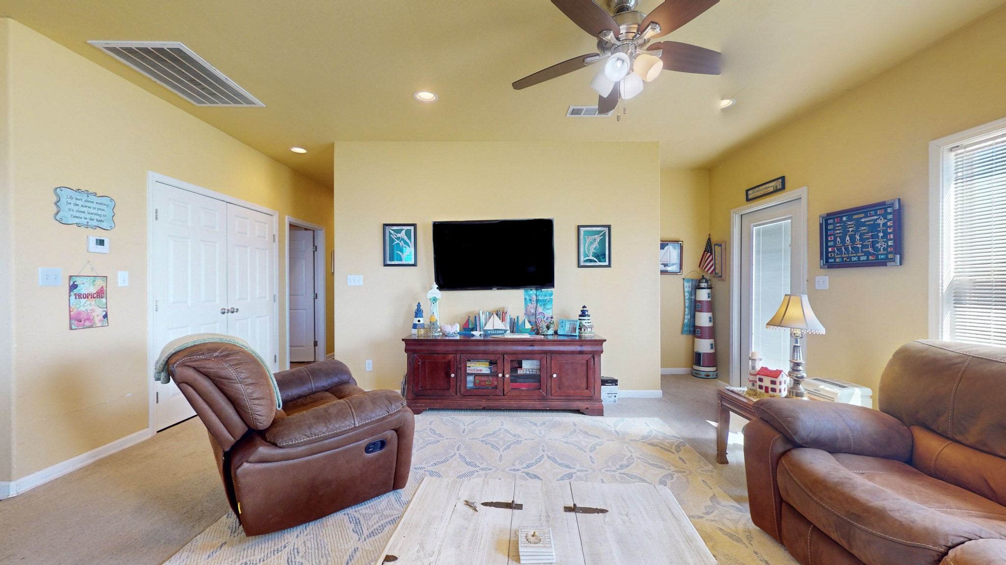 982 Kirks Road Port Bolivar, TX 77650 - Photo 15 of 39 a living room with furniture and a flat screen tv