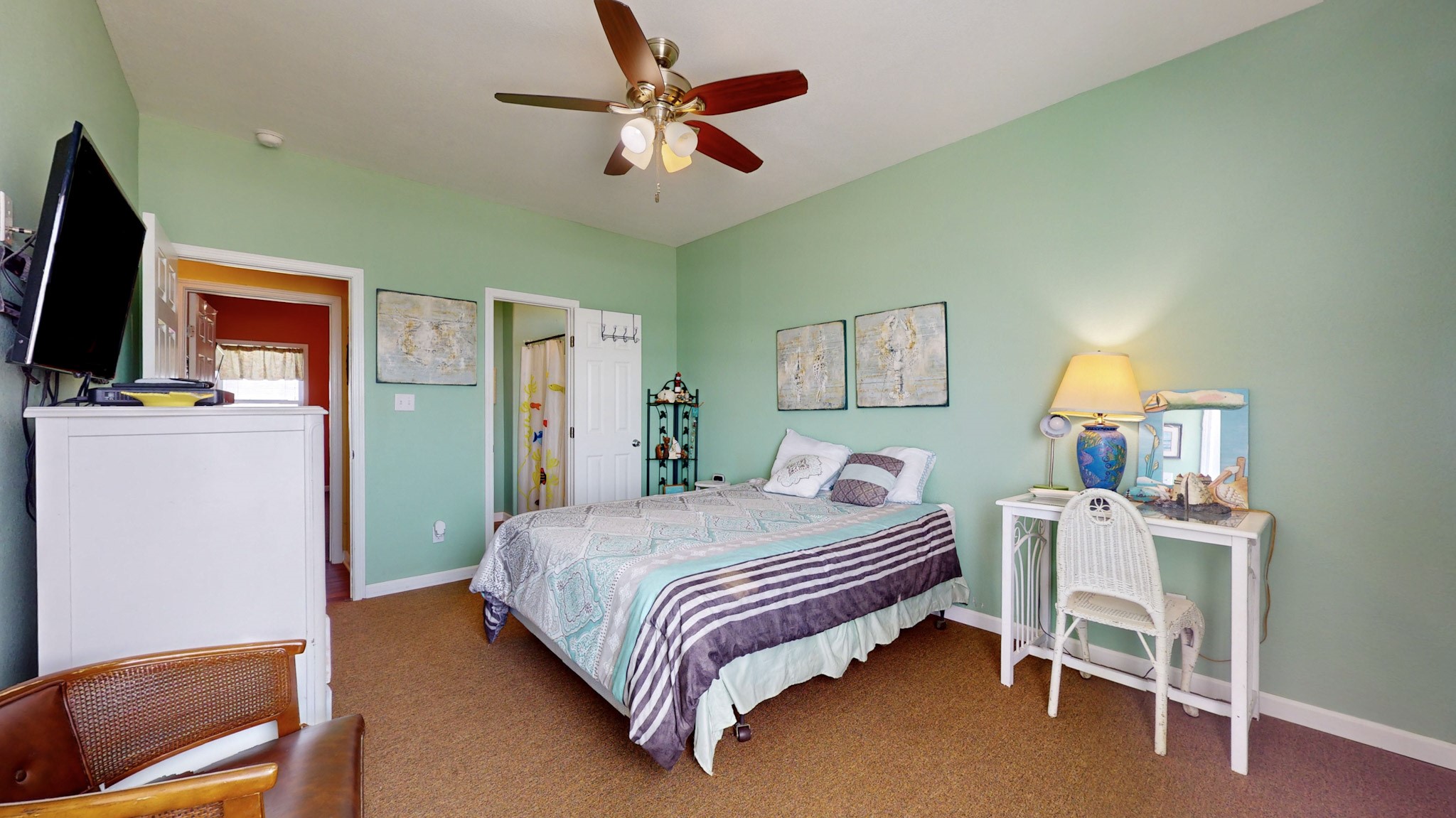 982 Kirks Road Port Bolivar, TX 77650 - Photo 20 of 39 a bedroom with a bed and a chandelier