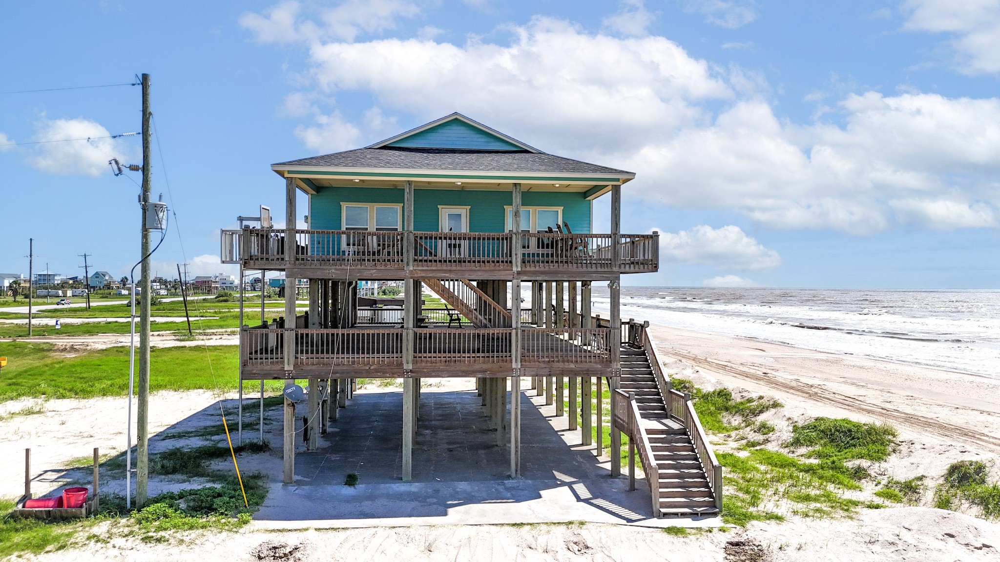 982 Kirks Road Port Bolivar, TX 77650 - Photo 2 of 39 a front view of a house with garden