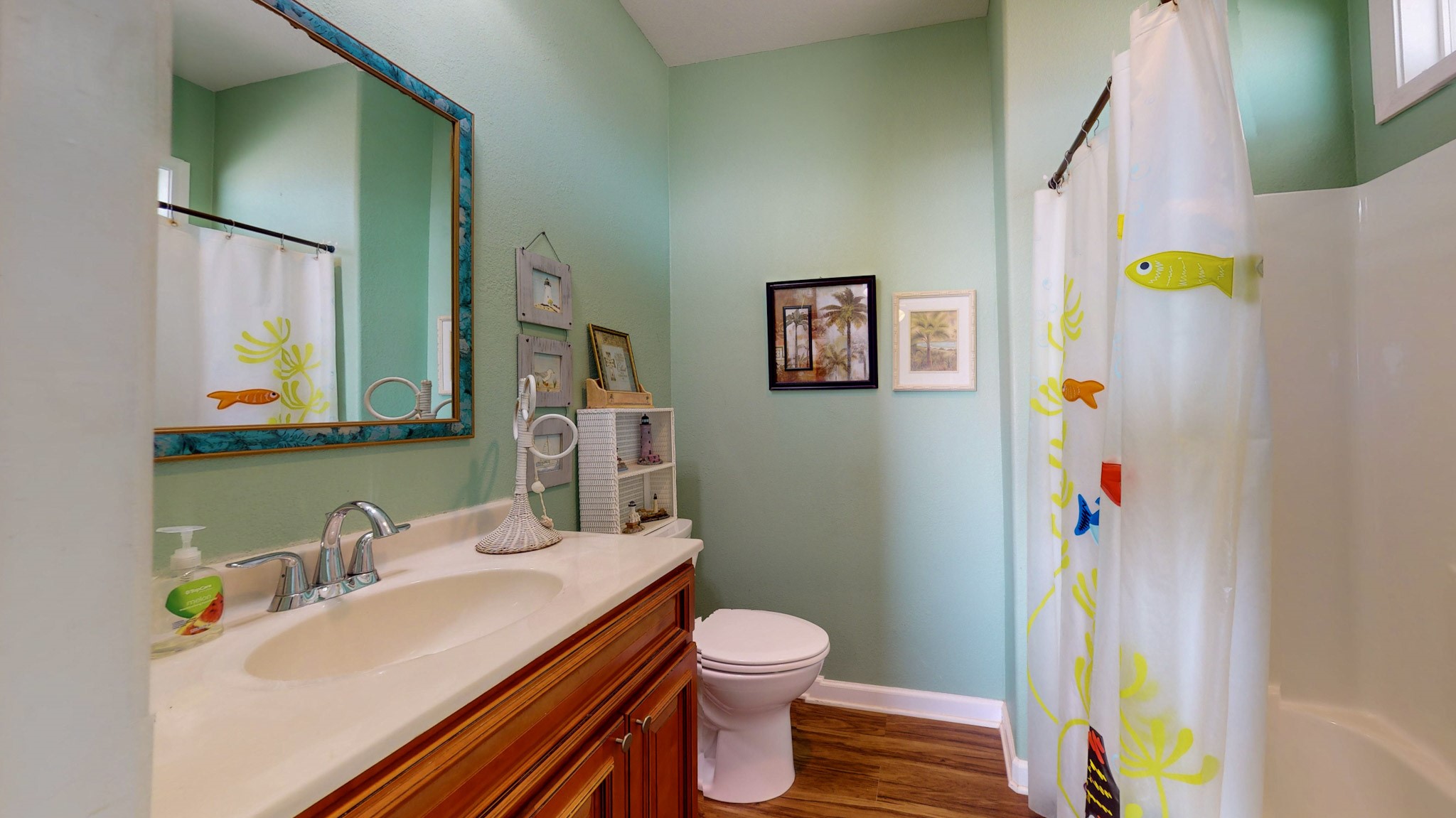 982 Kirks Road Port Bolivar, TX 77650 - Photo 23 of 39 a bathroom with a sink vanity mirror and toilet