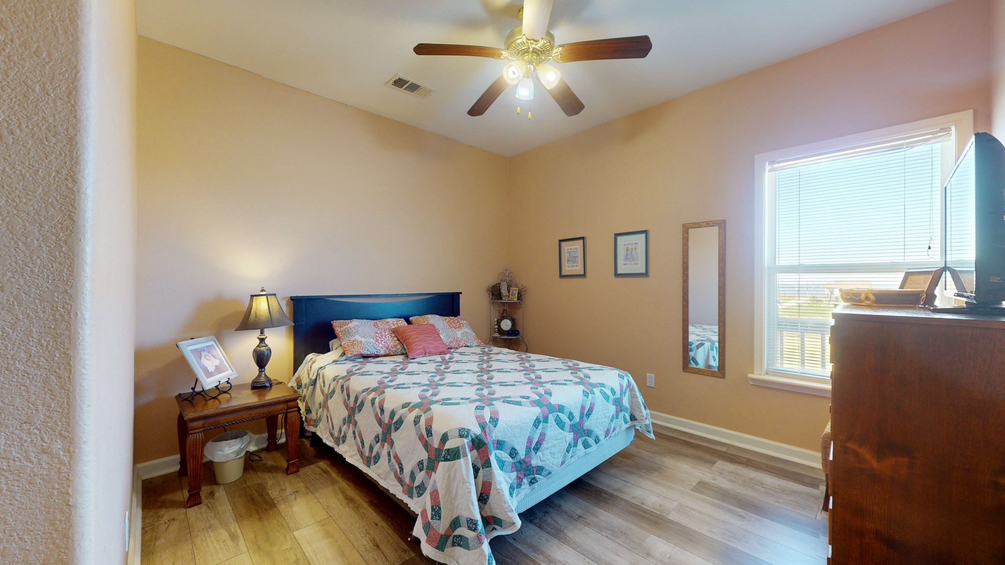 982 Kirks Road Port Bolivar, TX 77650 - Photo 25 of 39 a bedroom with a bed and a chandelier