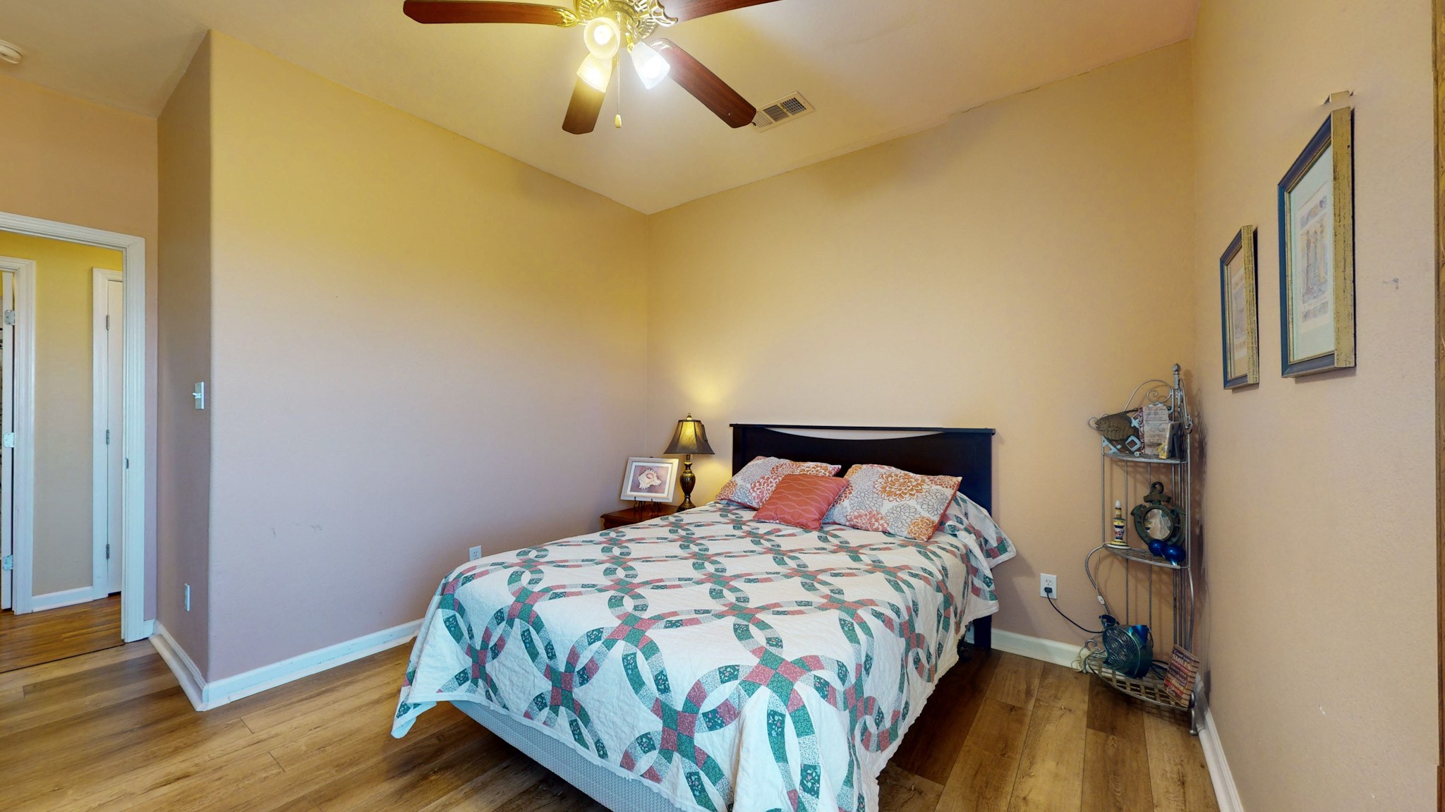 982 Kirks Road Port Bolivar, TX 77650 - Photo 27 of 39 a bedroom with a bed and wooden floor