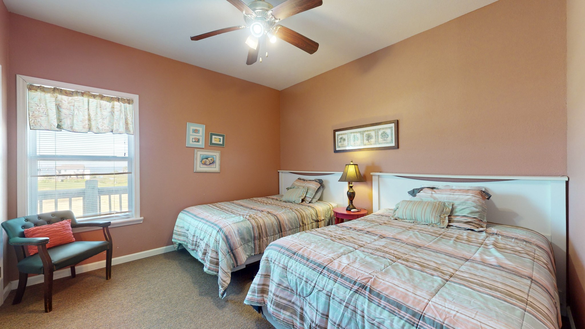 982 Kirks Road Port Bolivar, TX 77650 - Photo 28 of 39 a bedroom with two beds and a window