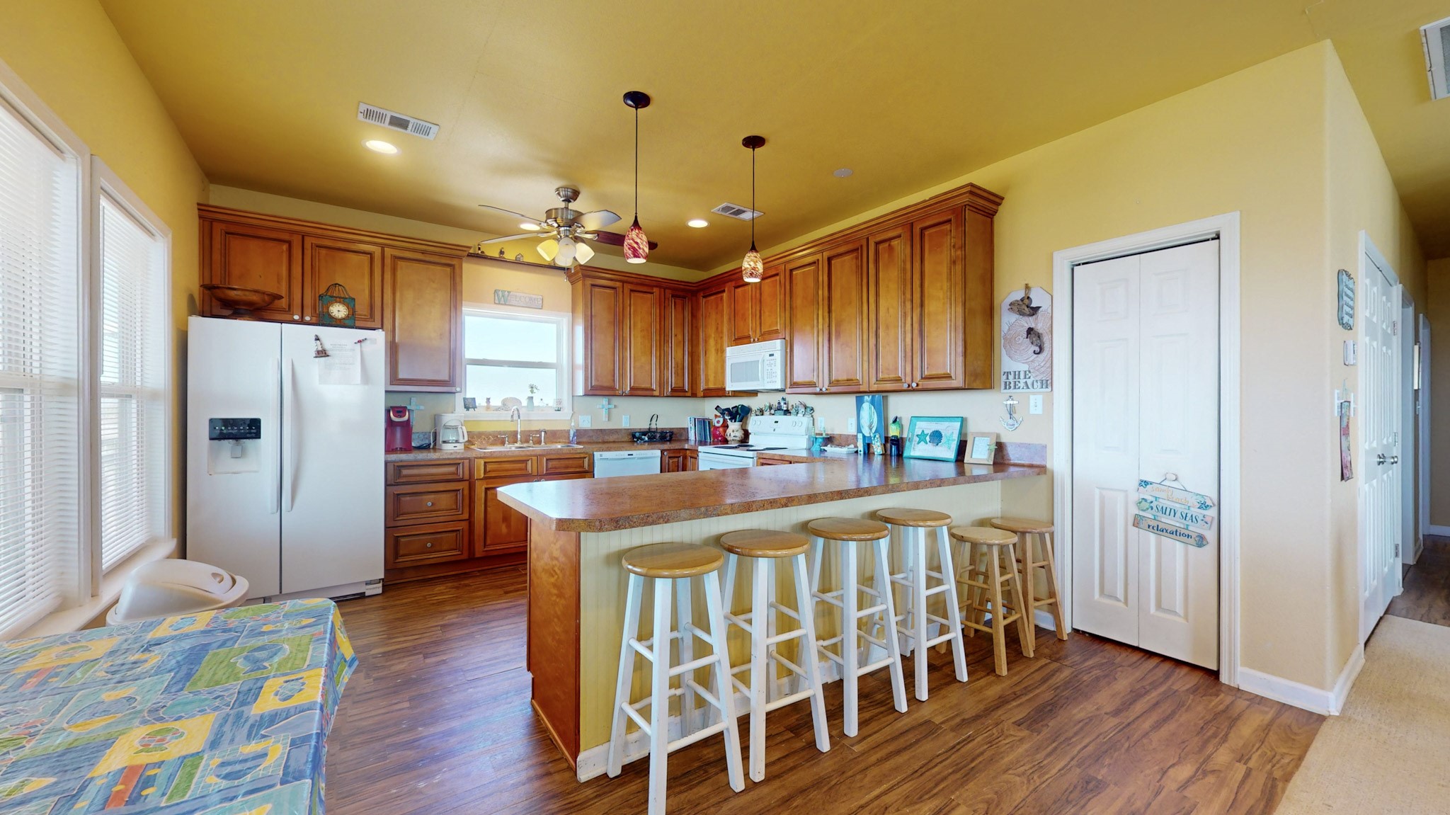 982 Kirks Road Port Bolivar, TX 77650 - Photo 8 of 39 a view of a kitchen and wooden floor