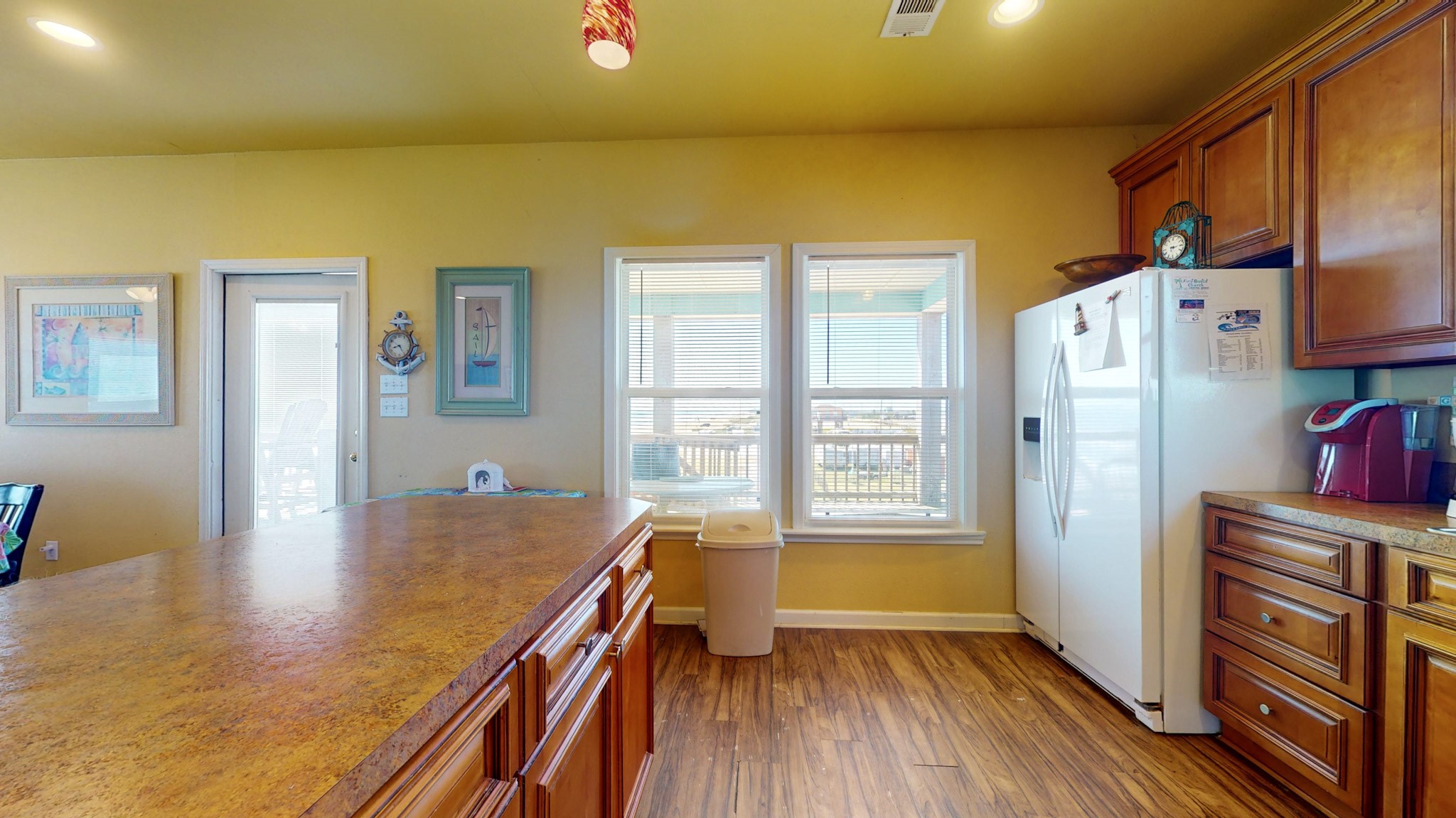 982 Kirks Road Port Bolivar, TX 77650 - Photo 10 of 39 a view of kitchen with furniture and wooden floor