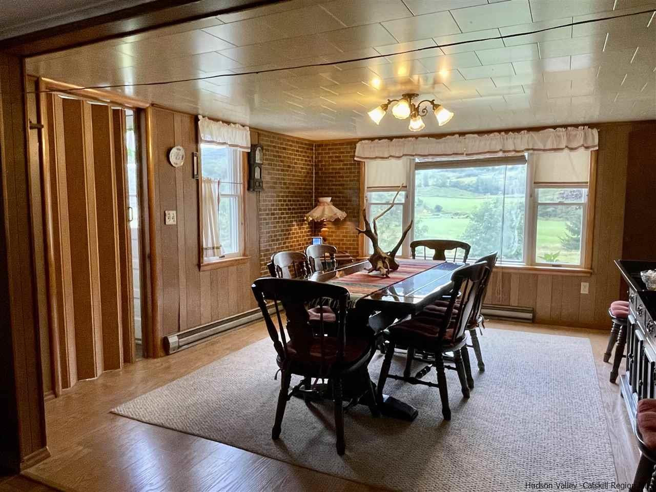 6277 County Rt 36 Denver, NY 12421 - Photo 11 of 27 a view of a dining room with furniture window and outside view