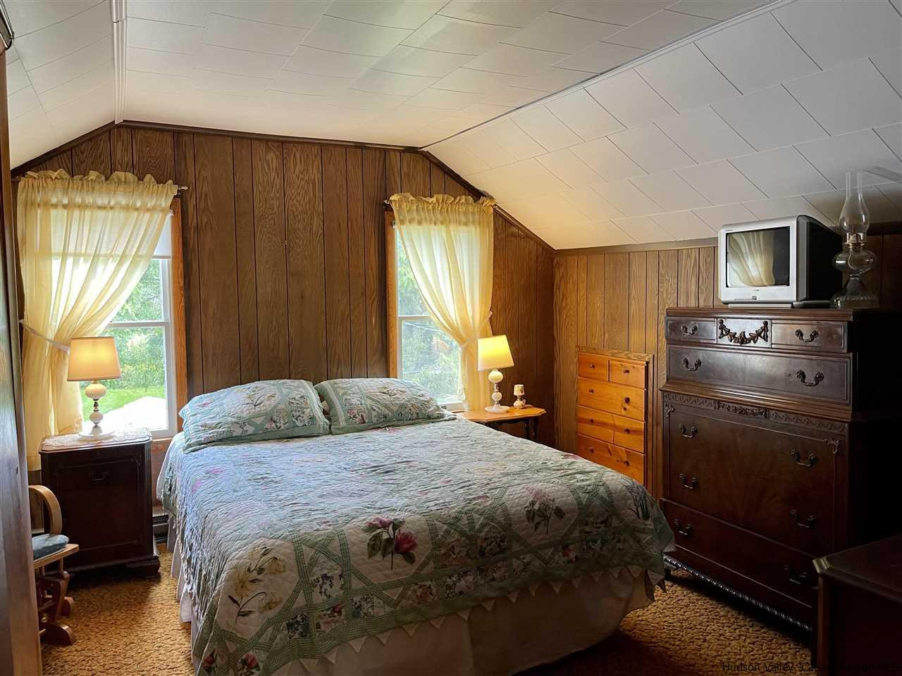 6277 County Rt 36 Denver, NY 12421 - Photo 18 of 27 a bedroom with a bed and a window