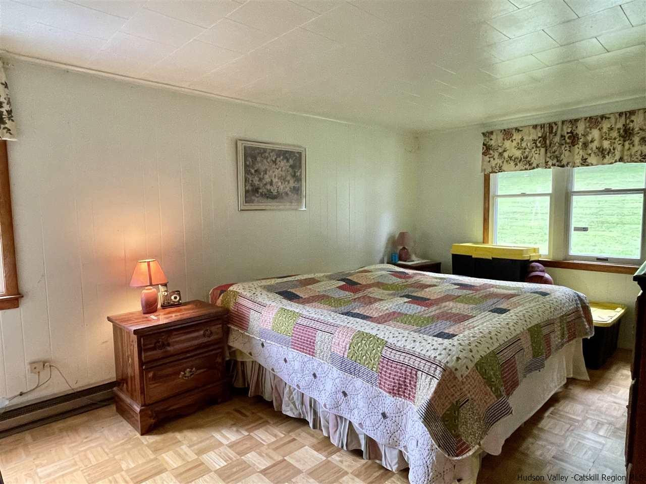 6277 County Rt 36 Denver, NY 12421 - Photo 22 of 27 a bedroom with a bed and a window