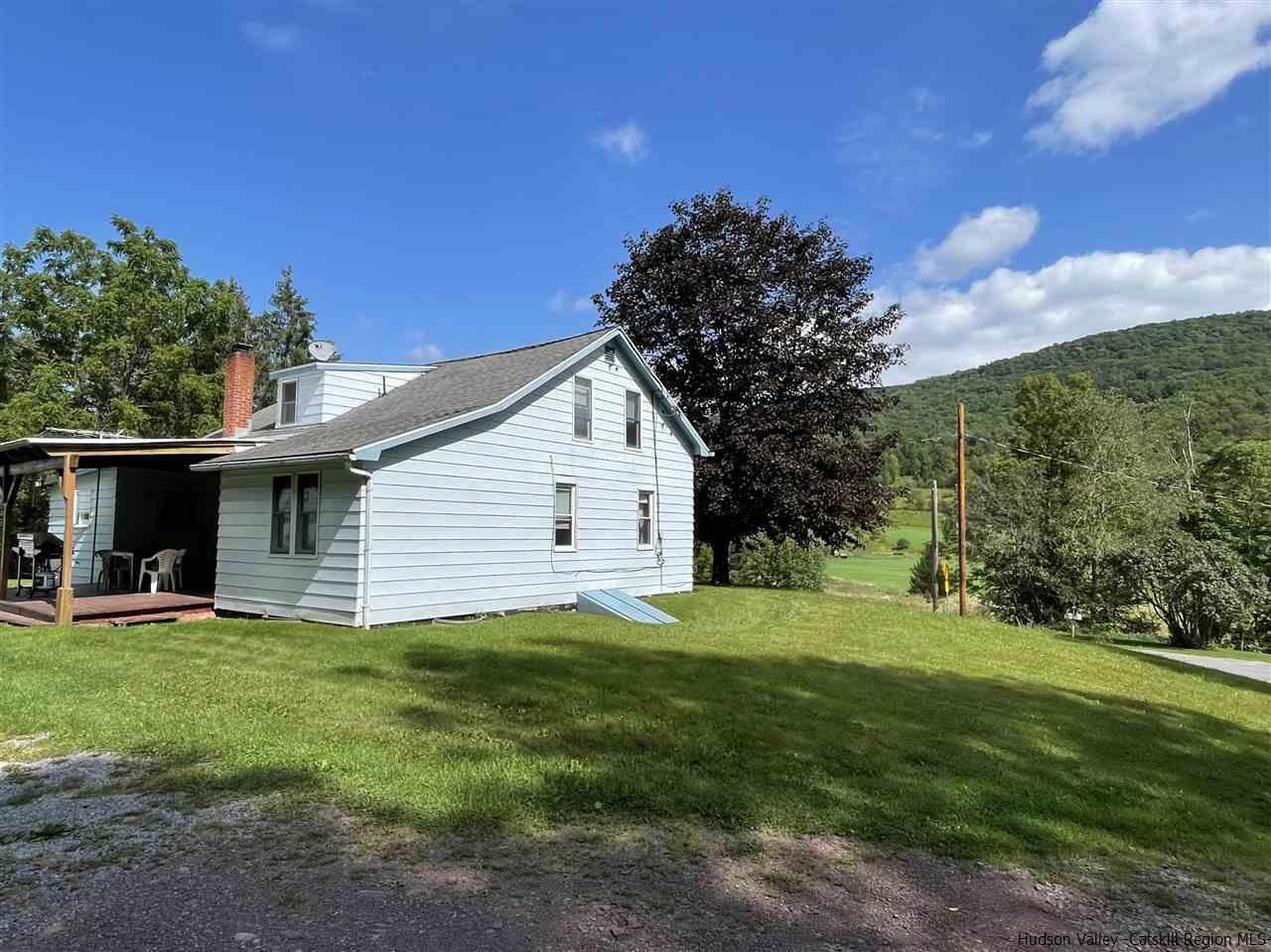 6277 County Rt 36 Denver, NY 12421 - Photo 26 of 27 a view of a house with a yard
