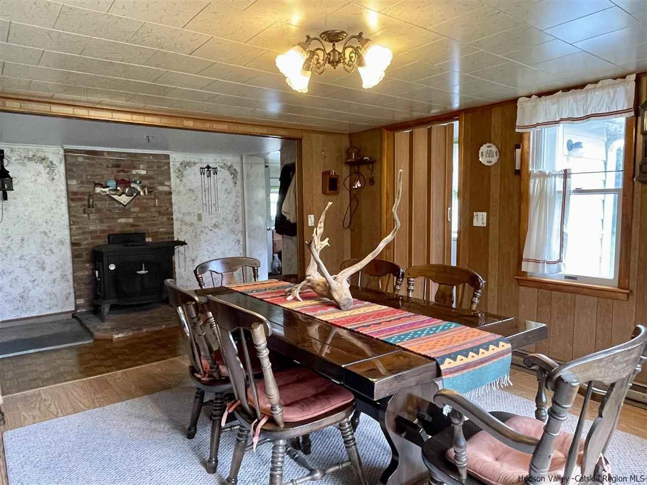 6277 County Rt 36 Denver, NY 12421 - Photo 9 of 27 a view of a dining room with furniture and window