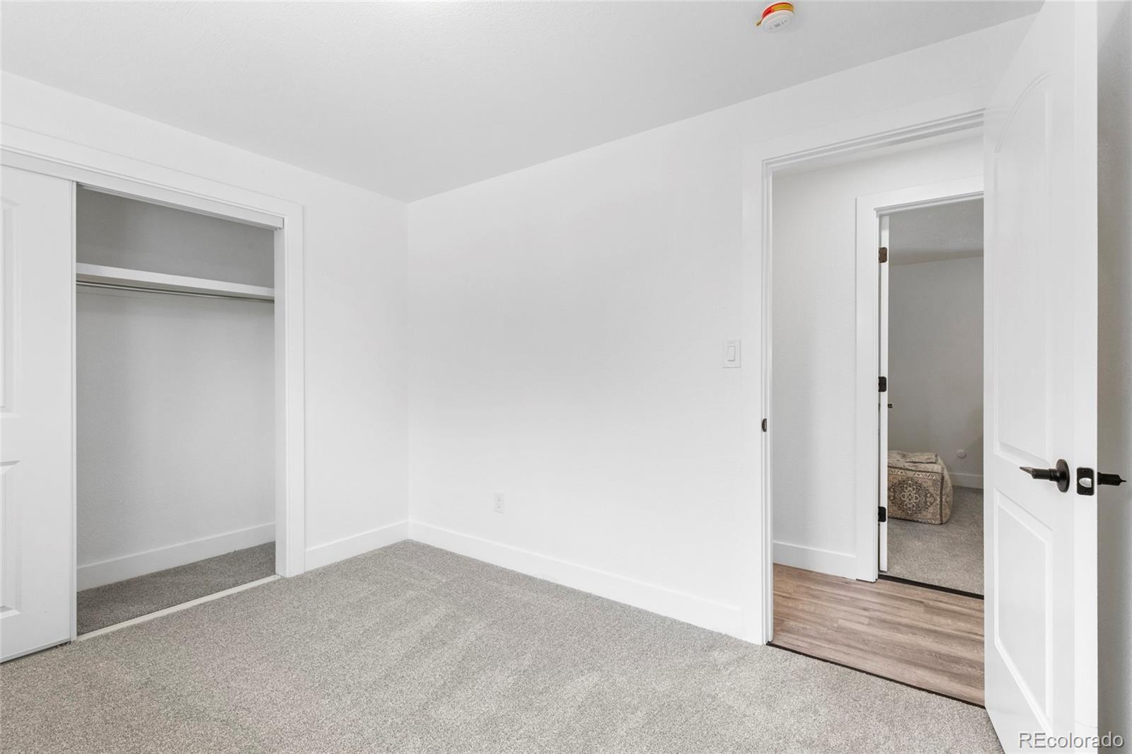 700 Busch Street Longmont, CO 80501 - Photo 20 of 27 an empty room with a bathroom