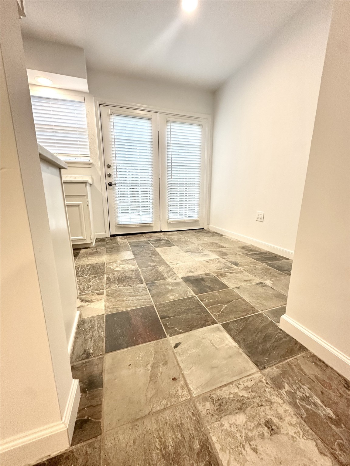 14771 Perthshire Road Houston, TX 77079 - Photo 6 of 23 a view of an empty room with a window