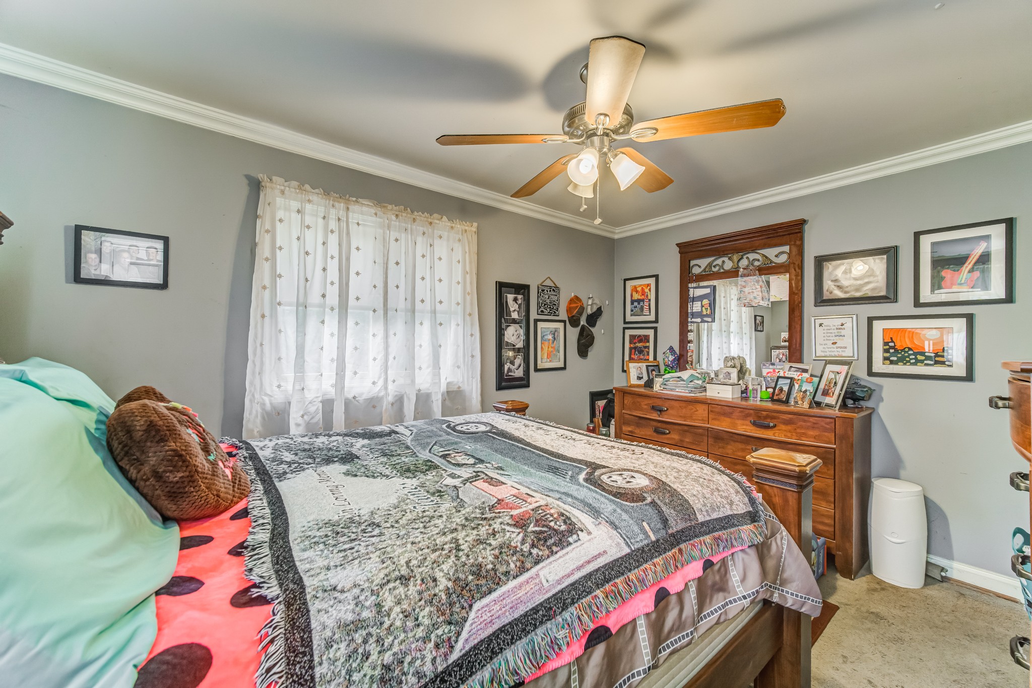 4302 Arno Road Franklin, TN 37064 - Photo 40 of 49 a bedroom with a bed and a chandelier