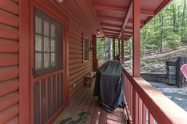a view of a balcony with furniture and wooden deck