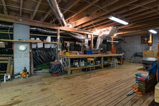 a view of a house with a balcony and car parked