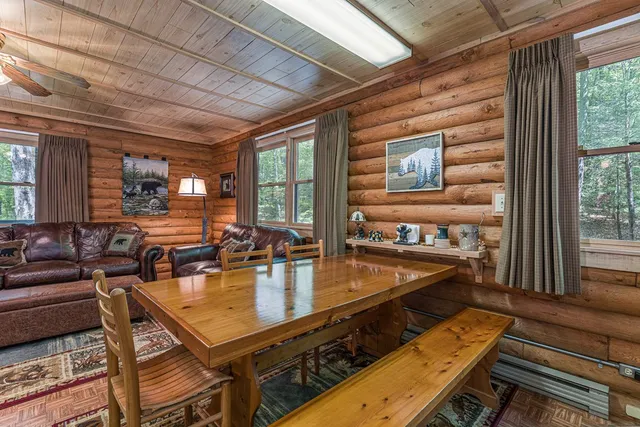 a room with lots of tables and chairs