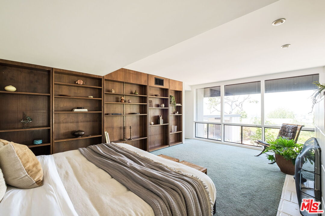 316 Redwood Drive Pasadena, CA 91105 - Photo 21 of 49 a bedroom with a bed and a large window