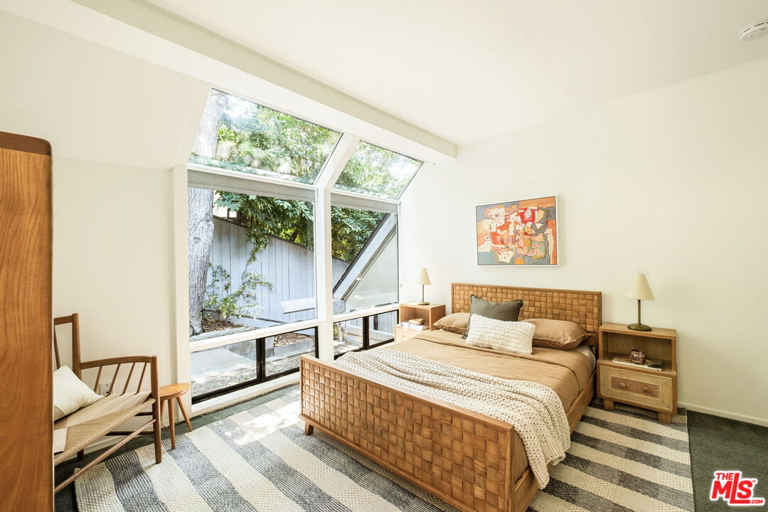 316 Redwood Drive Pasadena, CA 91105 - Photo 28 of 49 a bedroom with a bed and a large window