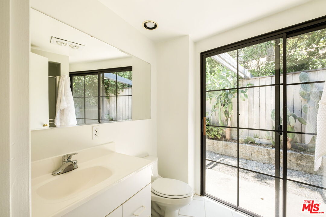 316 Redwood Drive Pasadena, CA 91105 - Photo 30 of 49 a bathroom with a sink toilet and shower