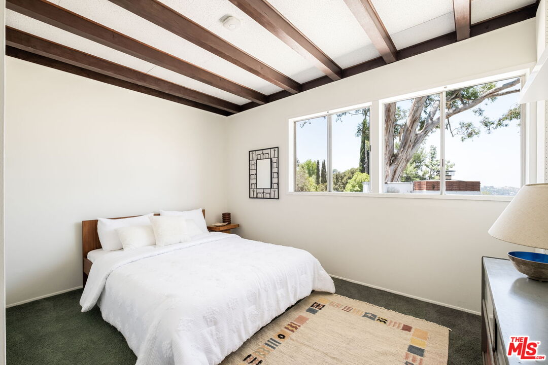 316 Redwood Drive Pasadena, CA 91105 - Photo 32 of 49 a bedroom with a bed and a window